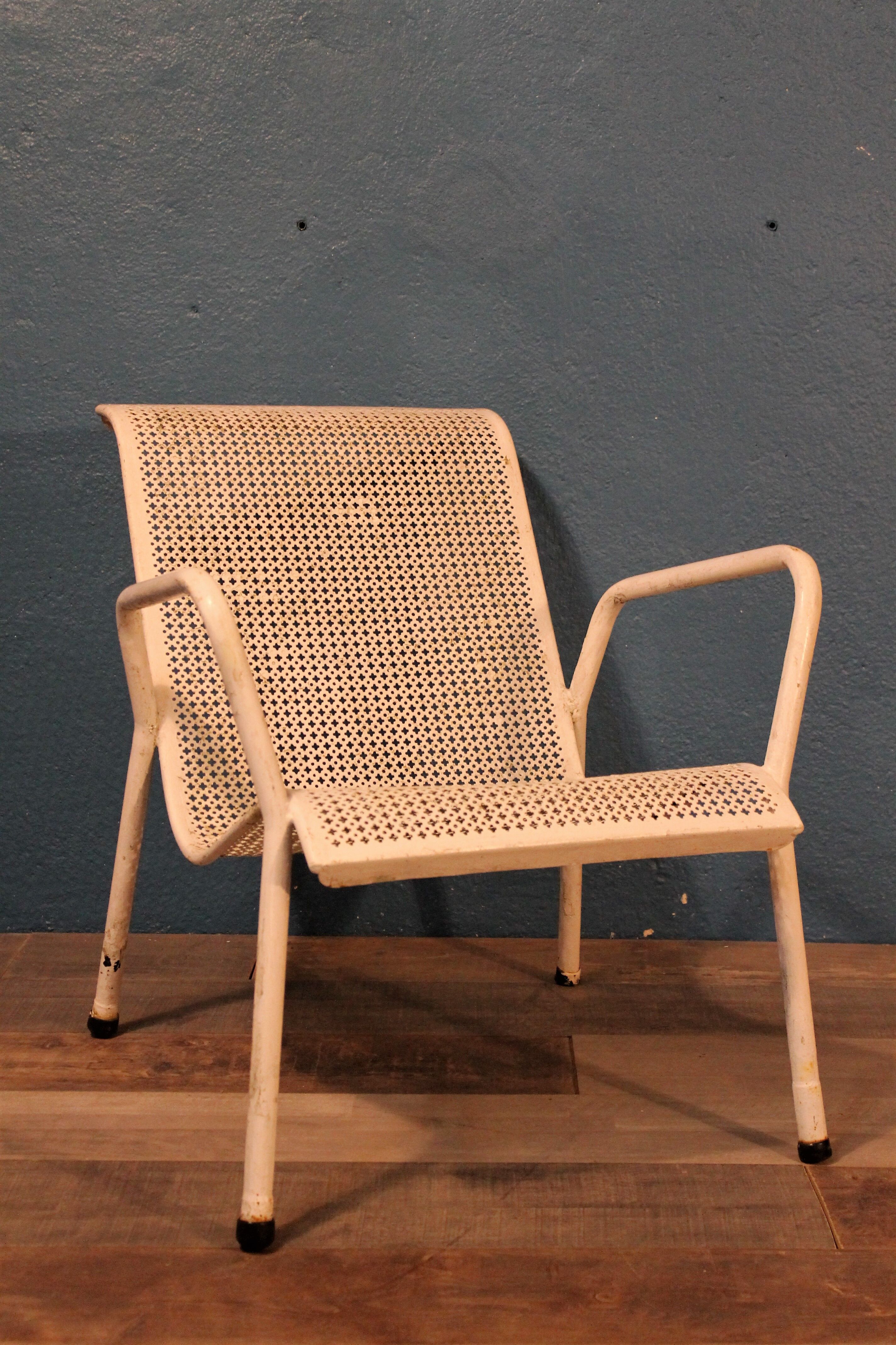 1960 perforated metal garden armchairs