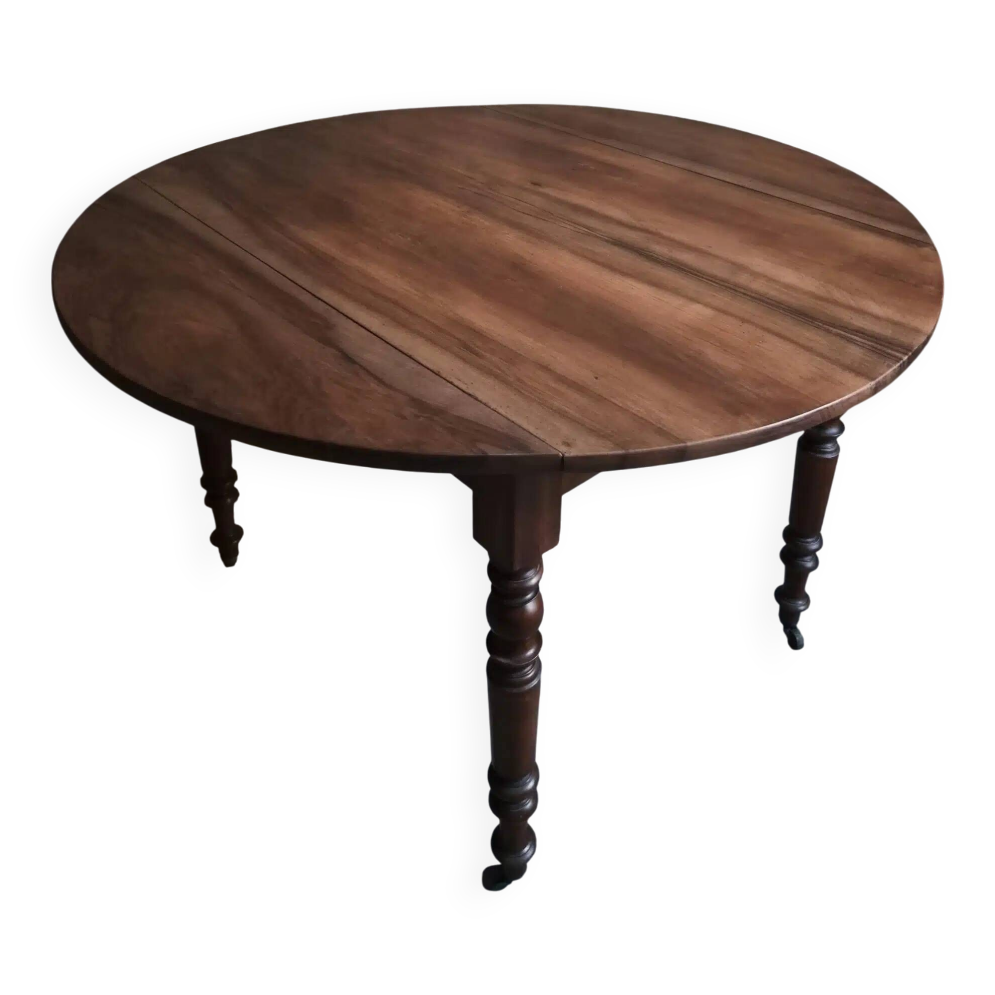 Antique drop-leaf dining table in walnut, France, circa 1900.