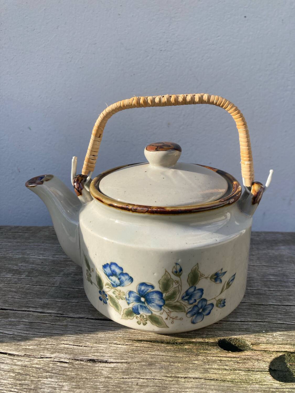 Chinese ceramic and rattan teapot