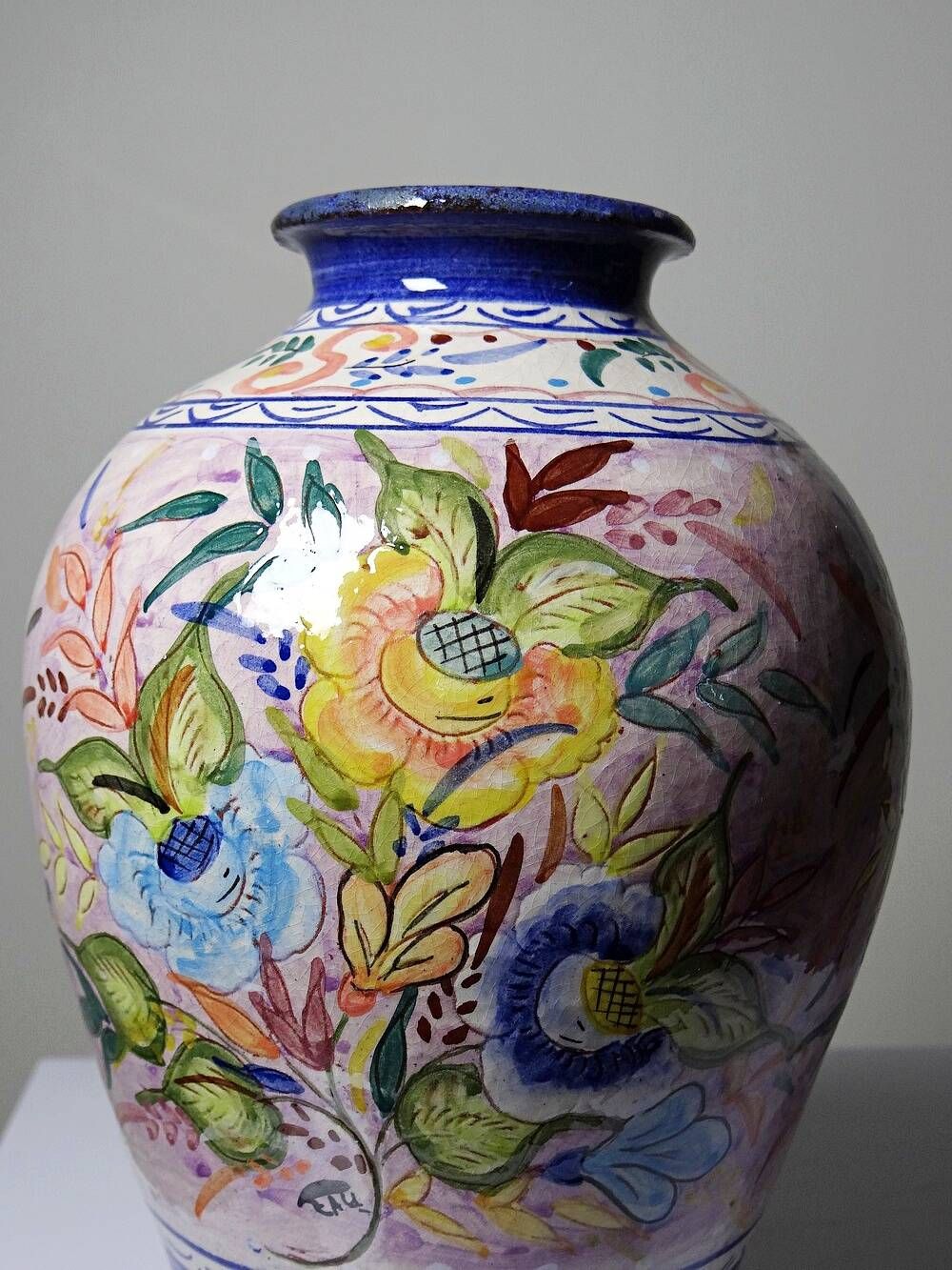 Vintage Portuguese vase in glazed terracotta with hand-painted floral decoration.