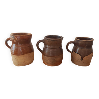 3 terracotta stoneware pitchers
