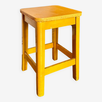 Yellow wooden stool