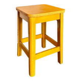 Yellow wooden stool