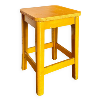 Yellow wooden stool