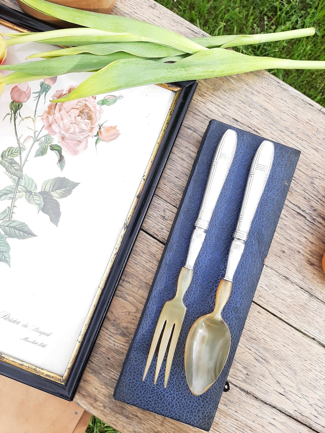 Corn and silver metal salad cutlery