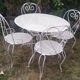 Mategot-style perforated wrought iron garden furniture with table and armchairs