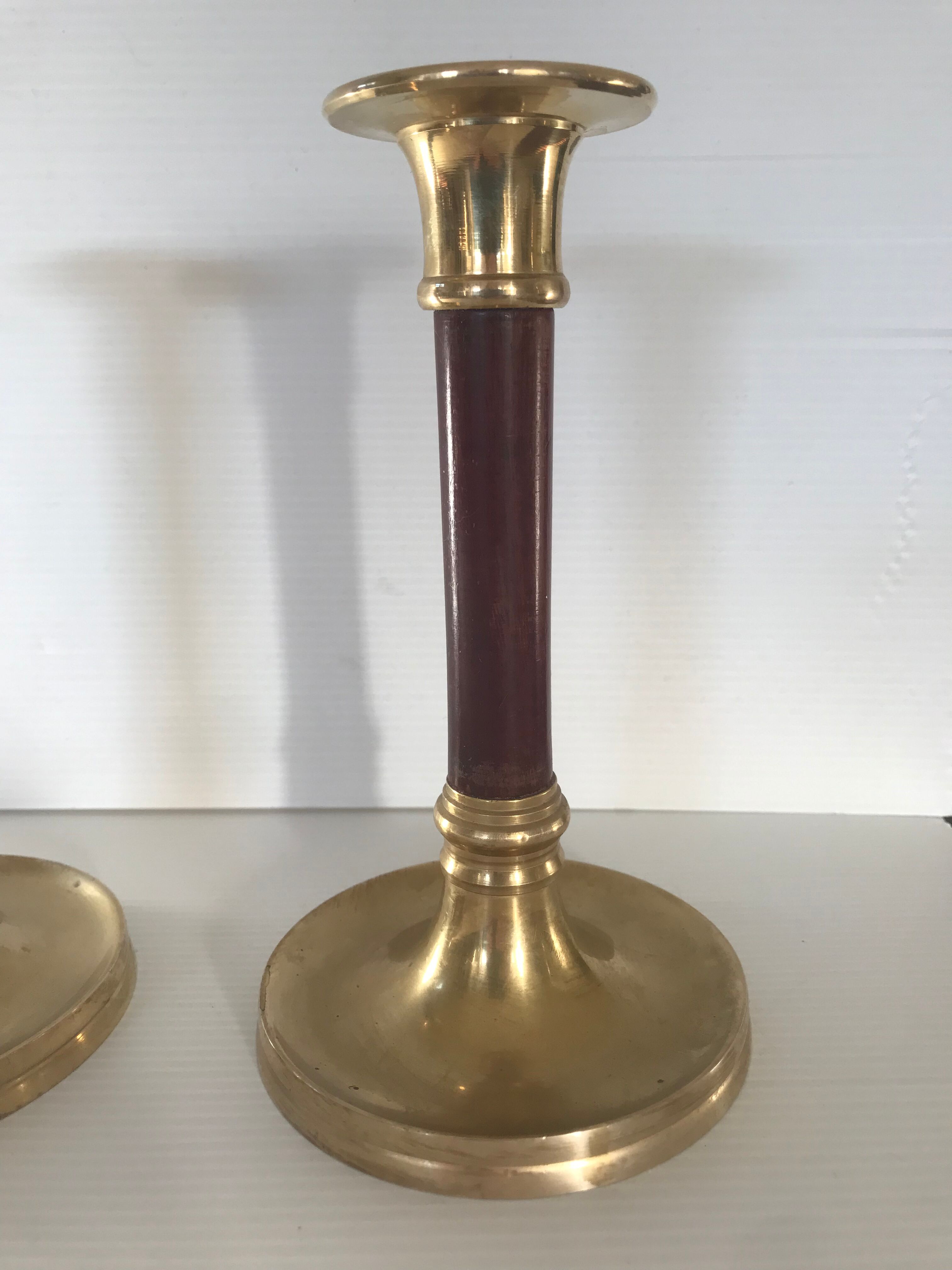 Pair of Scandinavian brass and teak candle holders