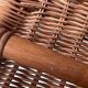 Magazine rack in turned wood and light brown rattan
