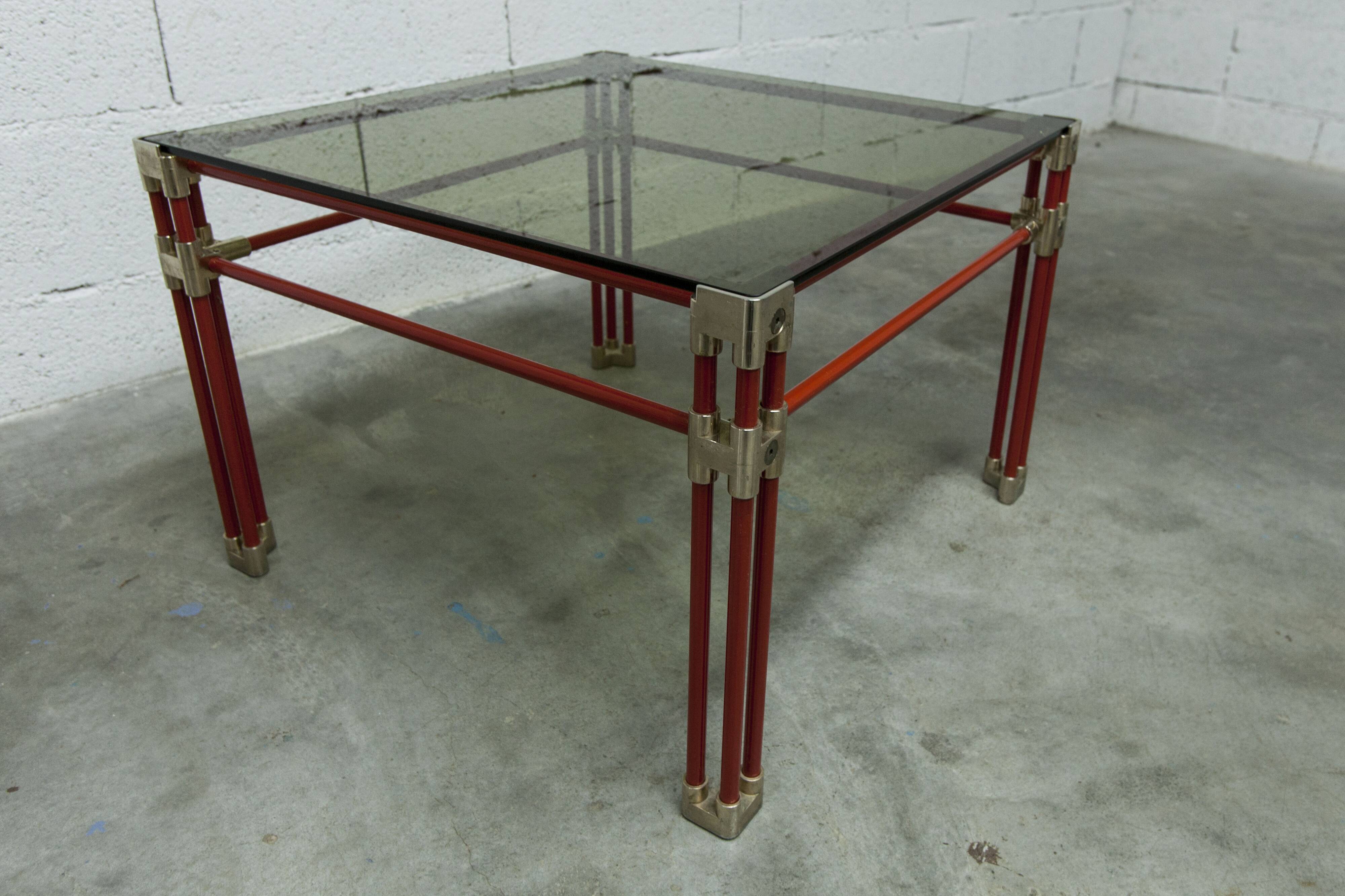 Postmodern Italian design coffee table in smoked glass with red steel structure