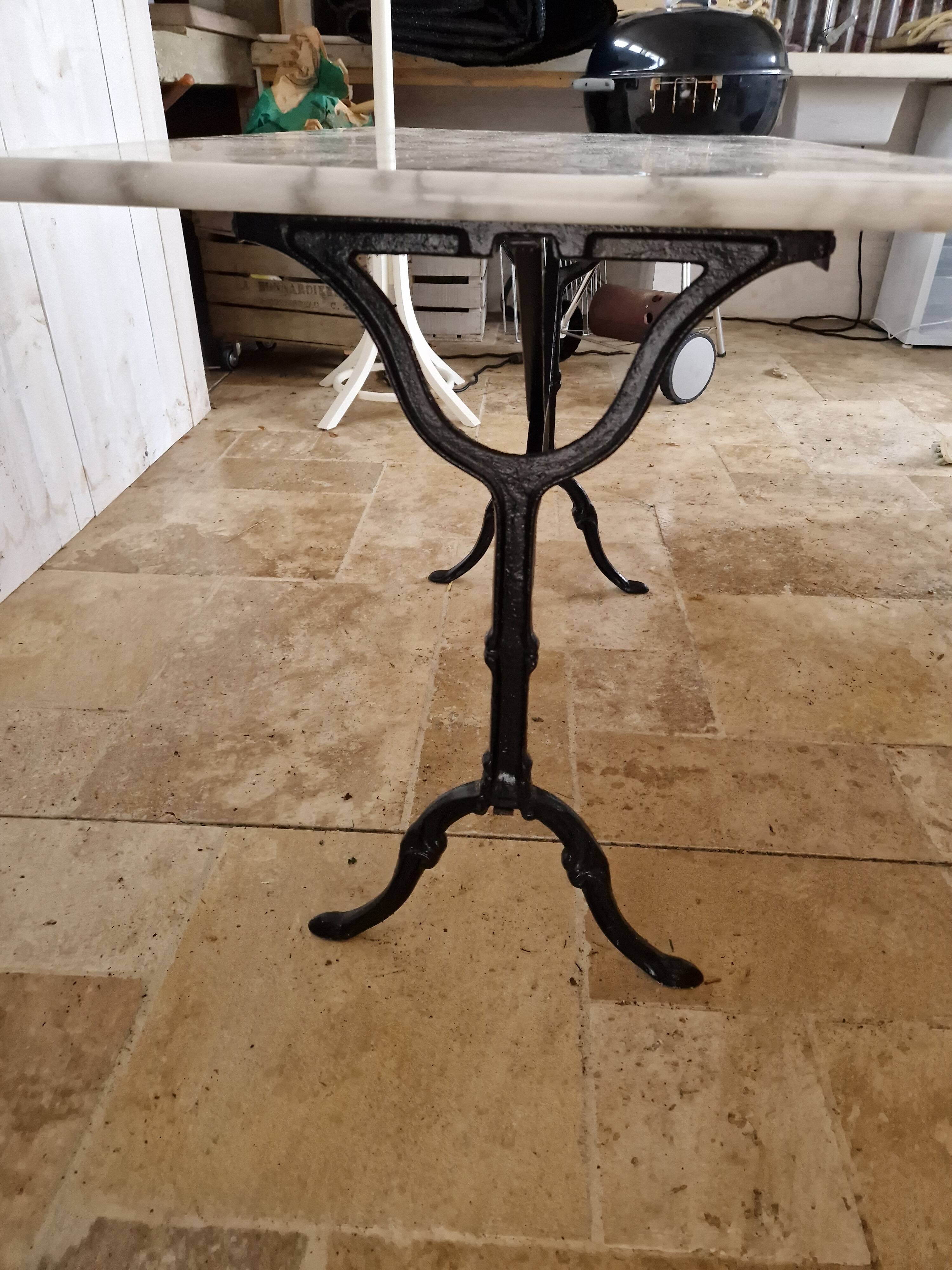 Bistro table with marble top and cast iron legs