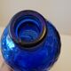 Vintage decanter bottle made of blue molded pressed glass