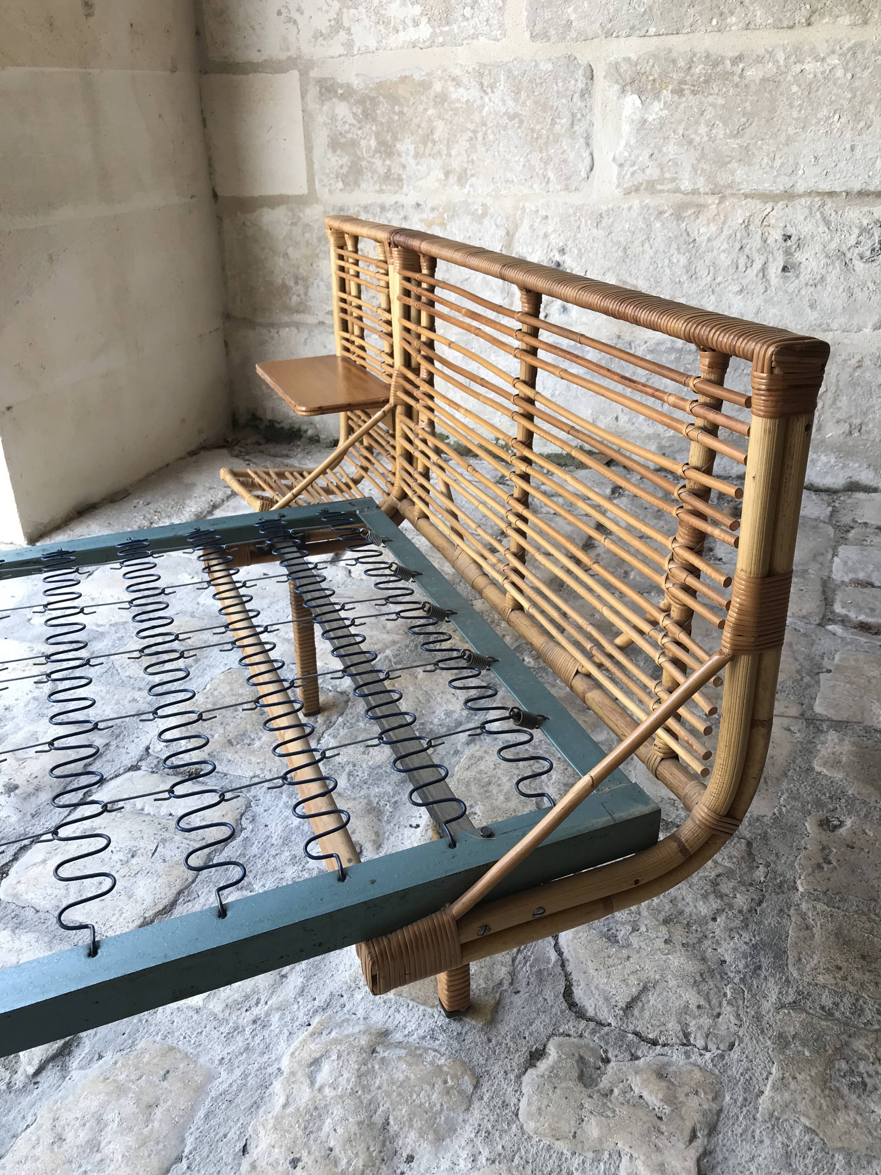 Twin rattan beds with built-in bedside tables