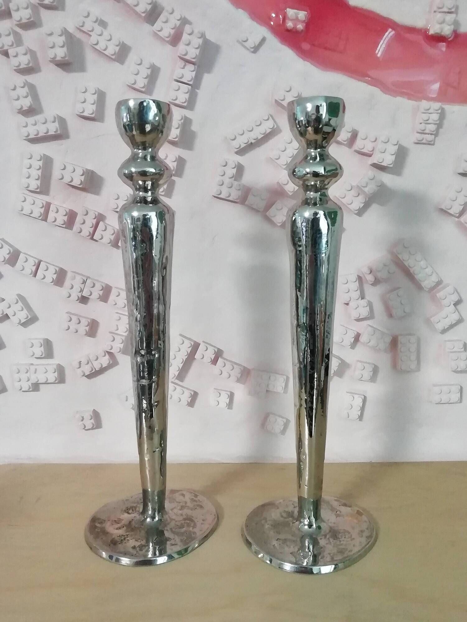 Pair of hammered metal candlesticks