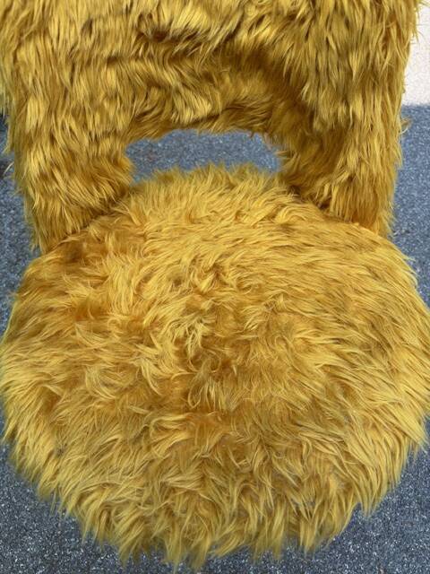 Old mustard furry armchair