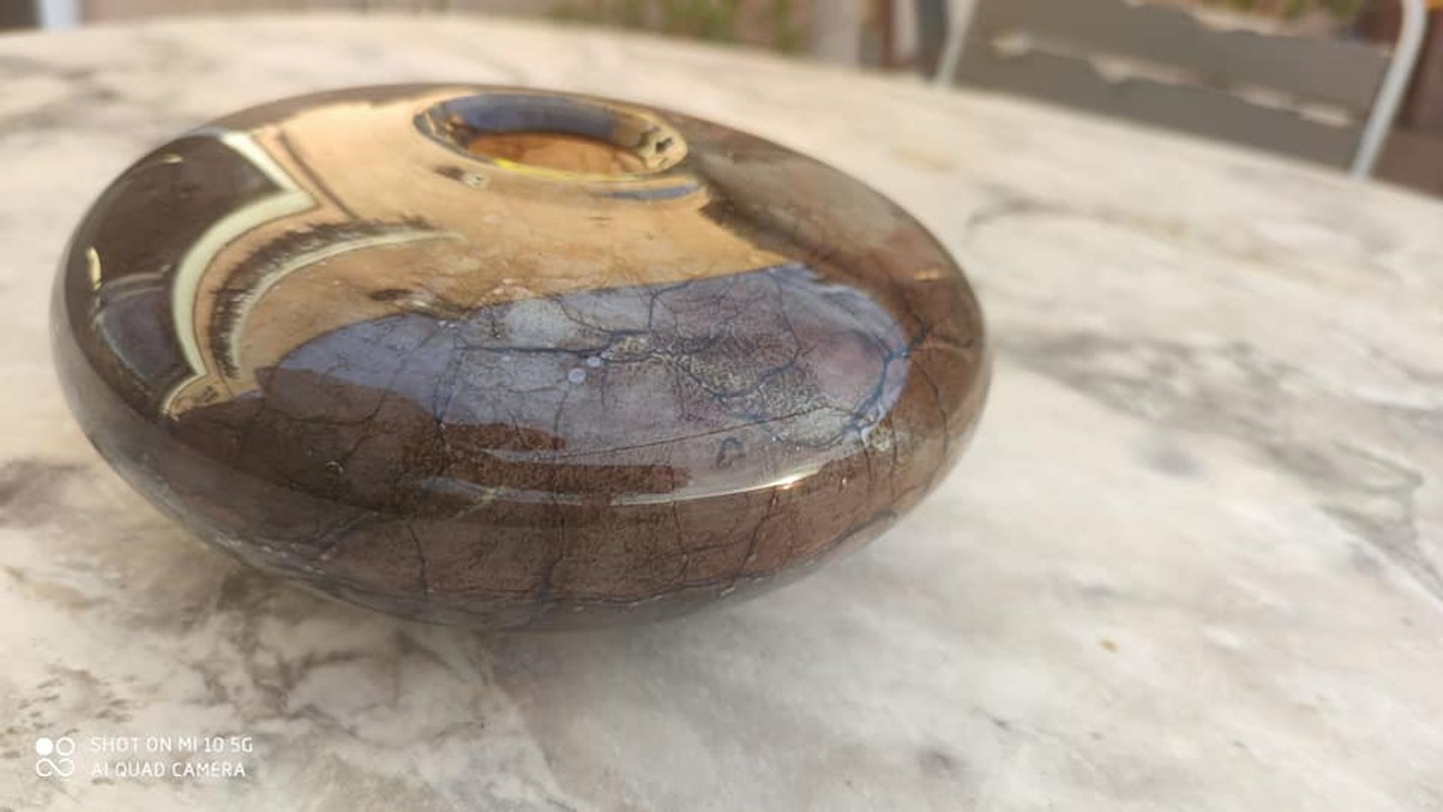 Flattened spherical vase made of glass paste