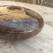 Flattened spherical vase made of glass paste