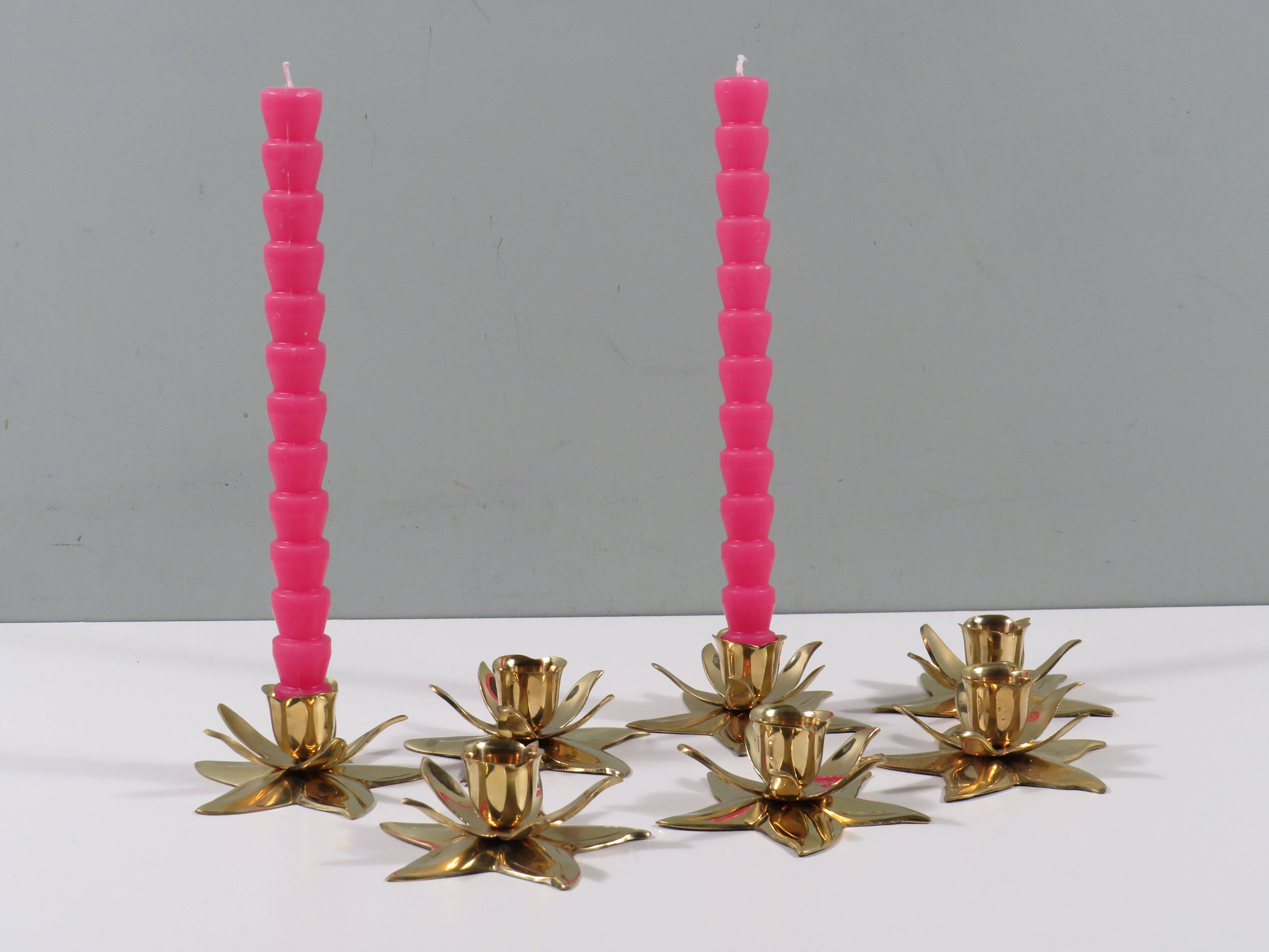 Set of 7 heavy shiny brass flower shaped candle holders, 1970-1980