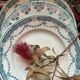 3 flat plates in ironstone with a floral green border.