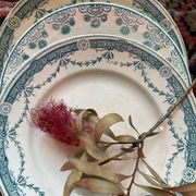 3 flat plates in ironstone with a green floral border