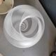 Frosted glass globe ceiling light with spiral patterns.