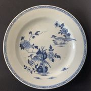 Blue and white porcelain plate of the blue family, 19th century