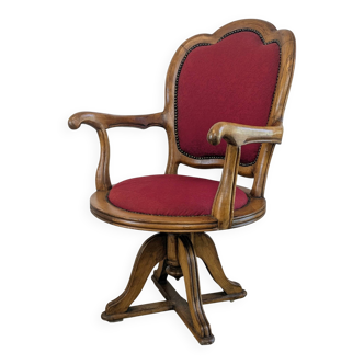 Vintage captain's chair in wood and garnet fabric — a seat with character