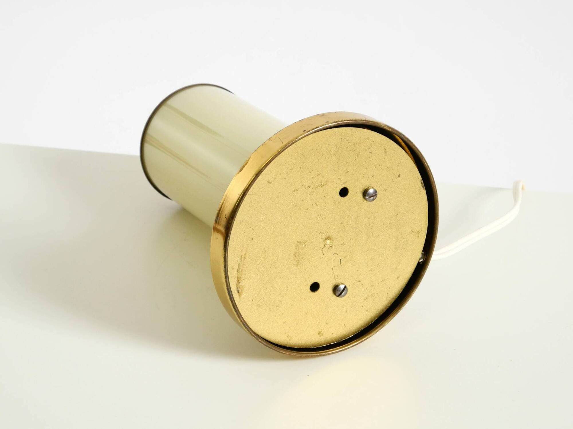 A beautiful, rare 1950s brass table lamp with one opal glass shade adorned