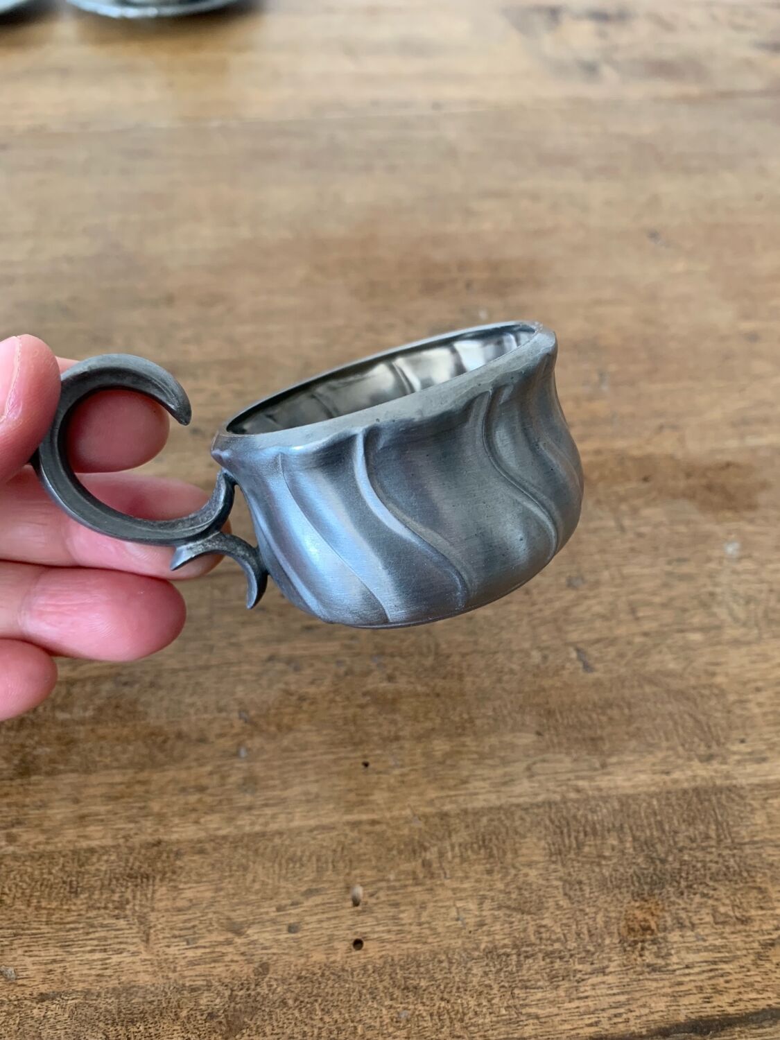 2 small porcelain cups and their pewter cup holders