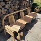 Baumann bench with wooden frame and faux leather seat.