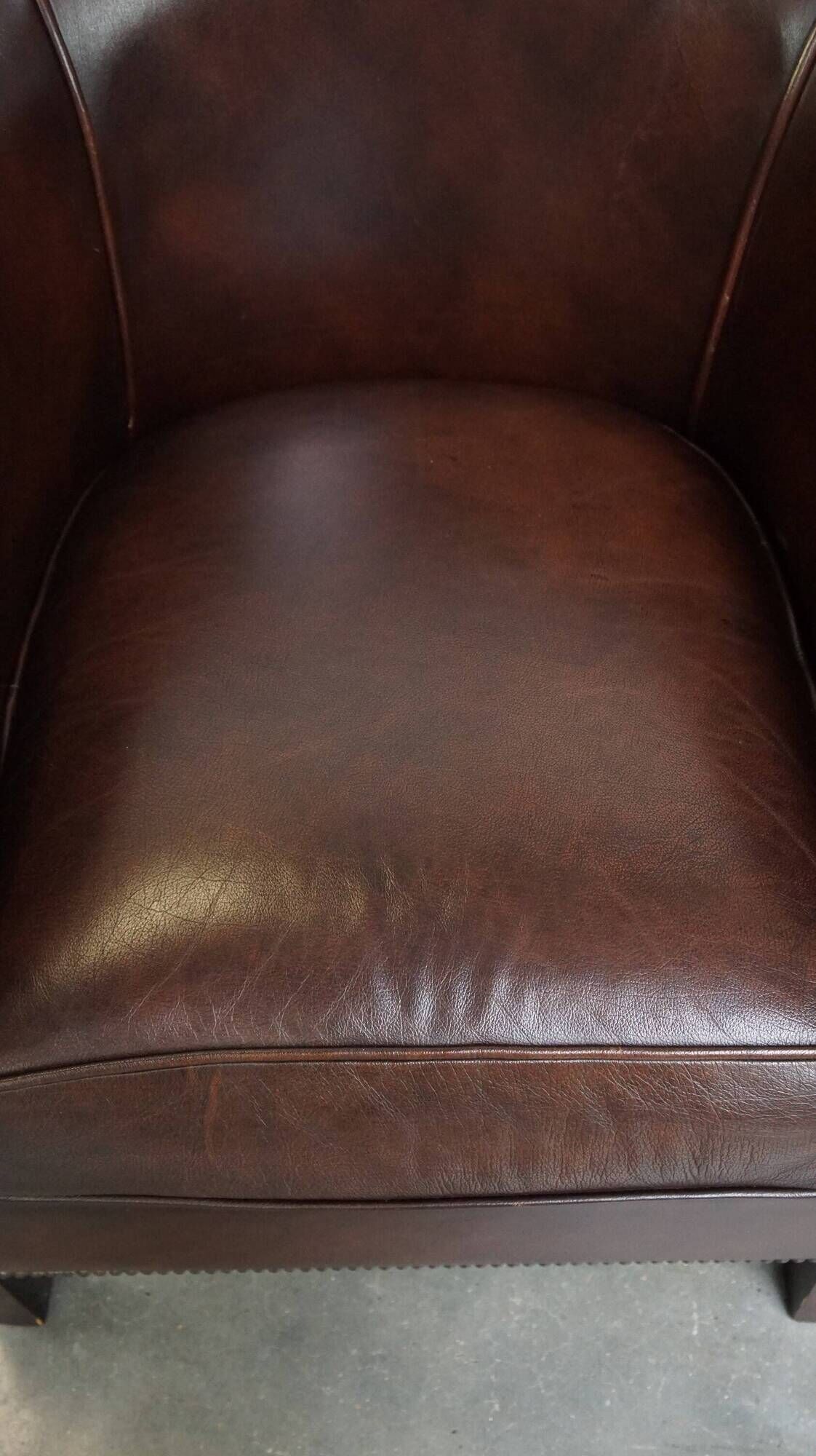 dark cowhide club chair in English style