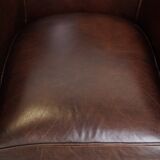 dark cowhide club chair in English style