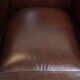dark cowhide club chair in English style