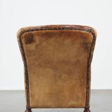 Fauteuil unique en cuir de mouton ancien