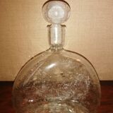 Clear bubble glass bottle molded for easy manual gripping