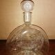 Clear bubble glass bottle molded for easy manual gripping