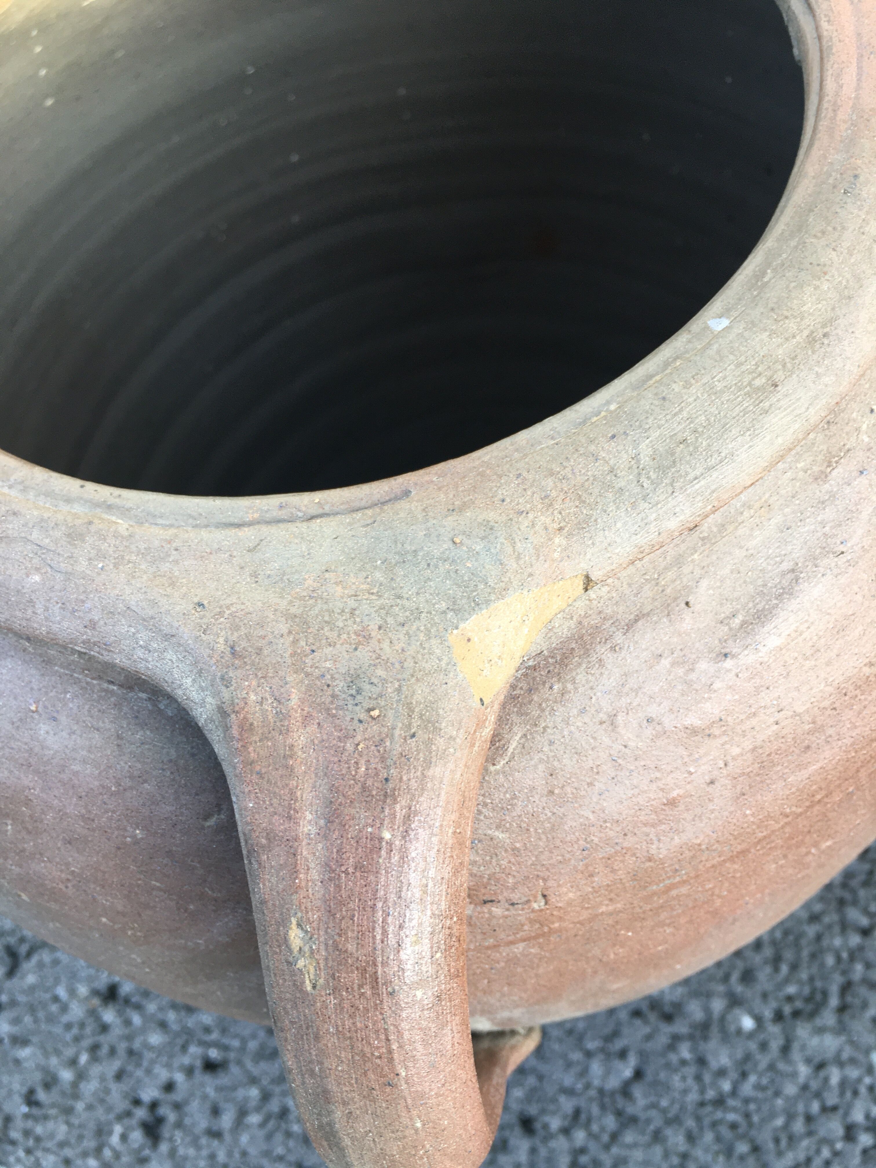 Old jug with two sandstone handles