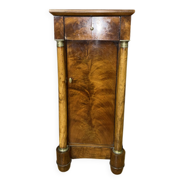Empire period bedside table in walnut with detached columns.