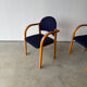 Set of two stackable beech chairs in curved Scandinavian style from IKEA.