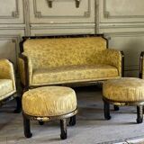 A set of two armchairs, a sofa and two poufs in lacquered wood with gilded chinoiserie decoration.