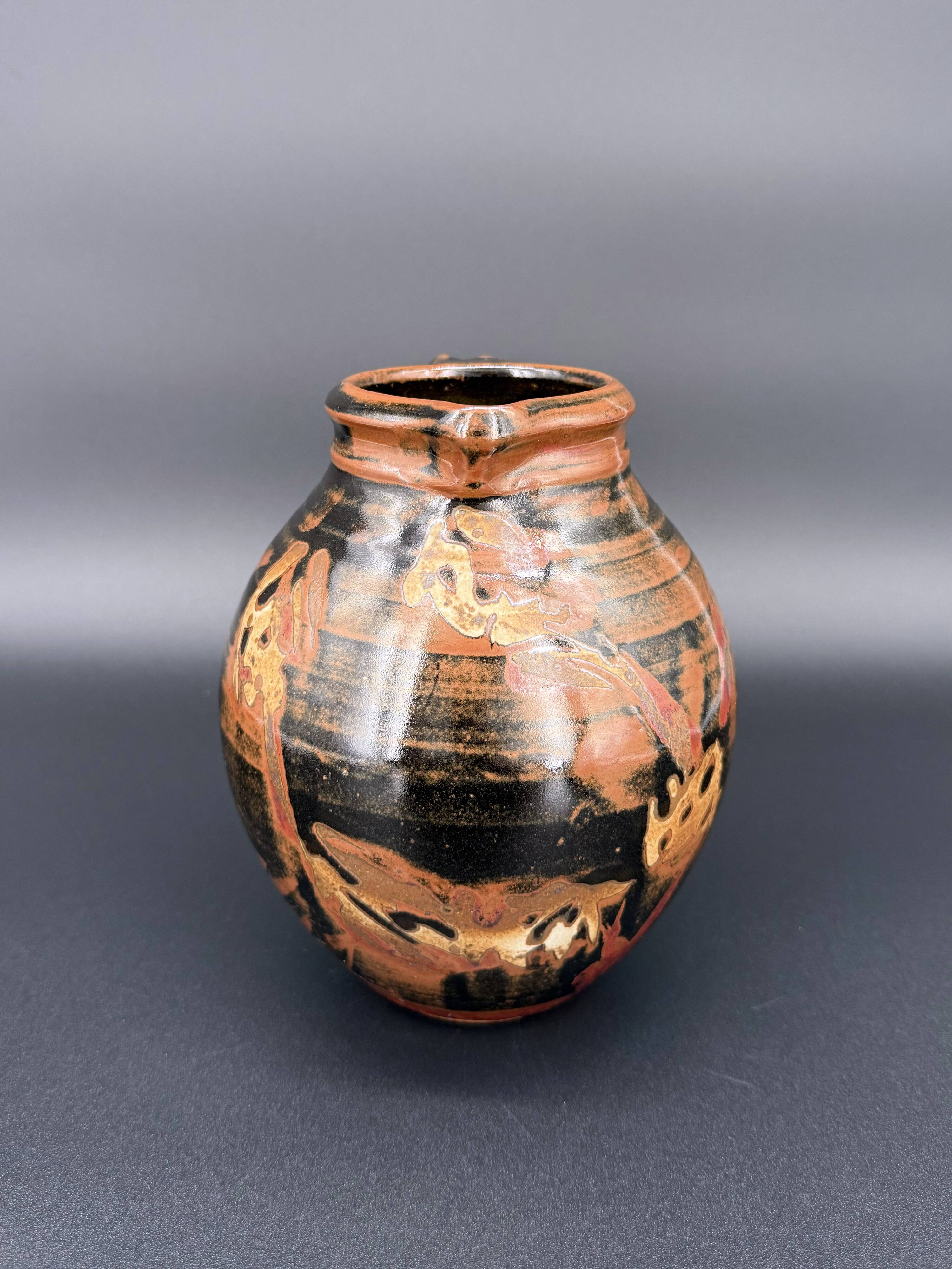 Signed black and red glazed stoneware pitcher, French artisanal ceramics