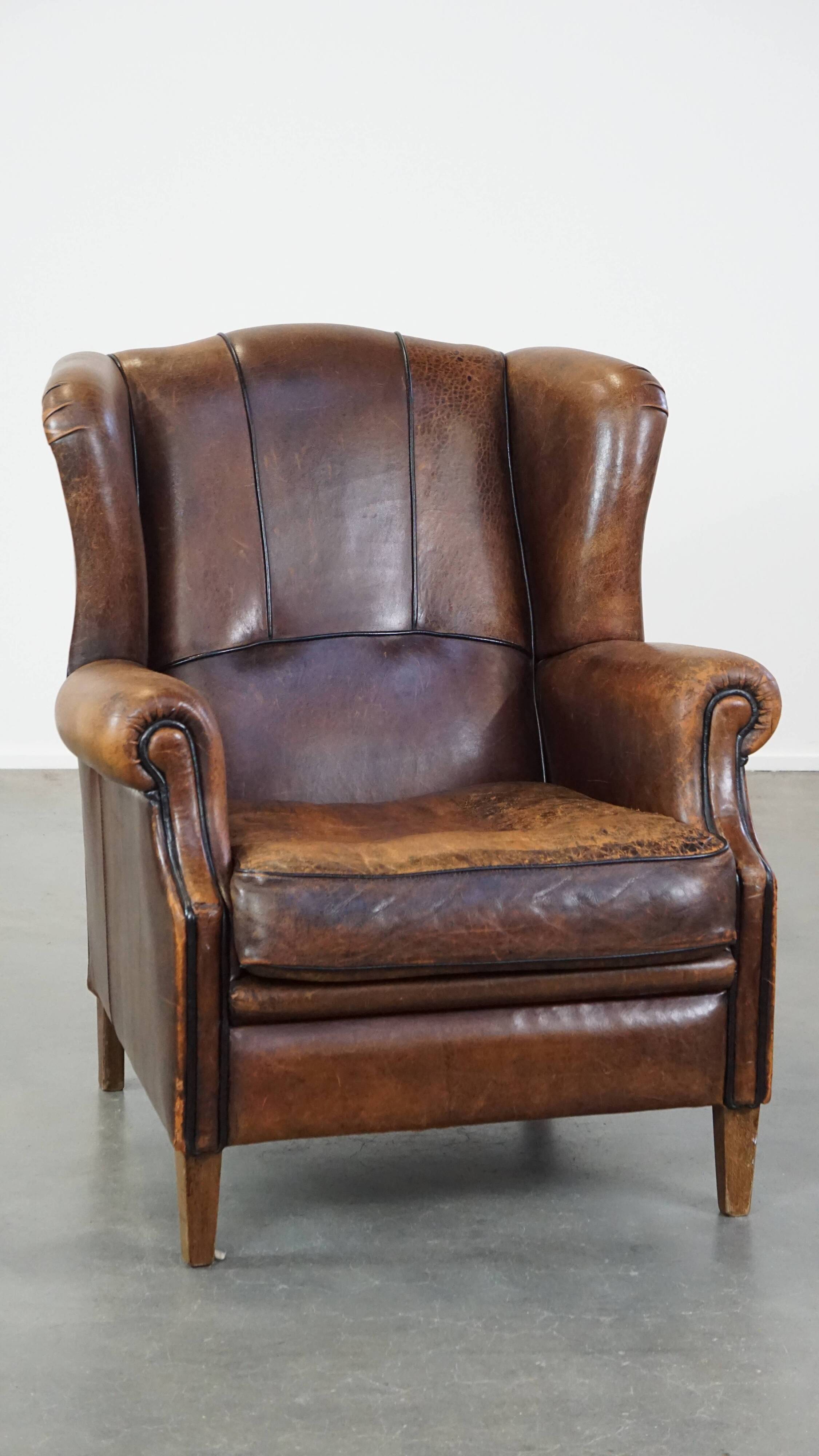Sheep leather wing chair with patina