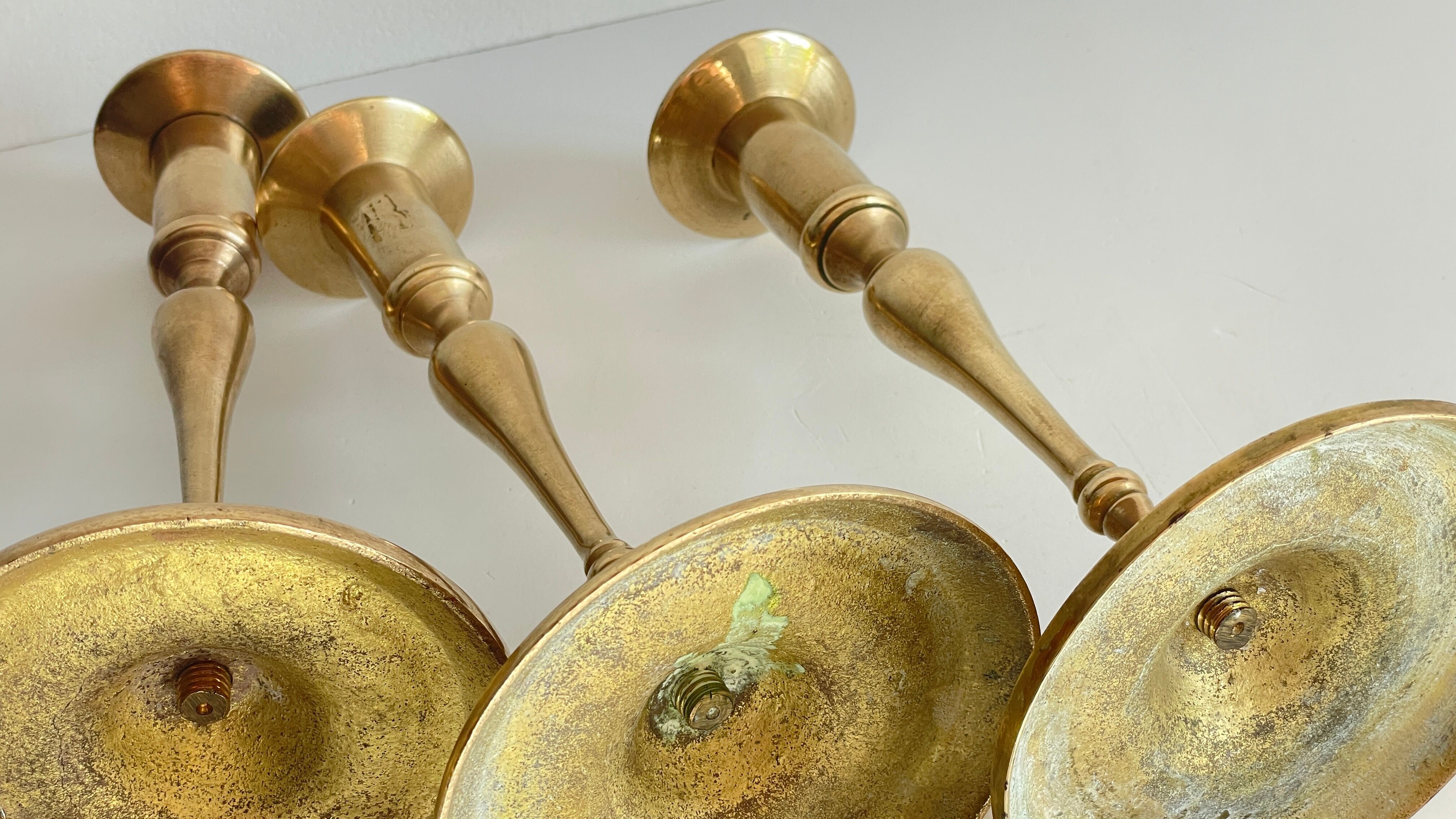 3 patinated brass candle holders