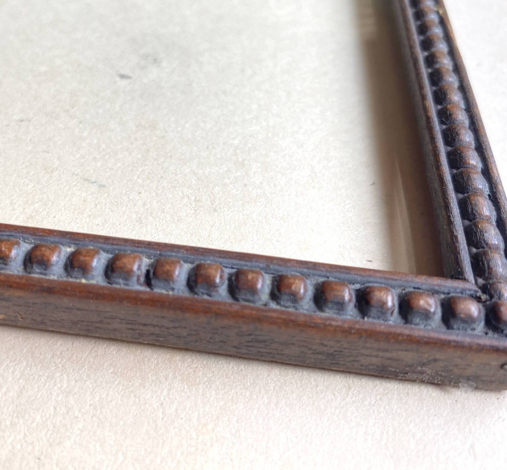 Wooden frame carved in beads, glazed, gray cardboard back and irzft paper