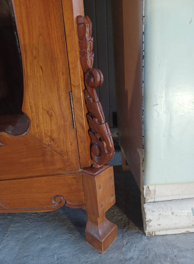 Large glass and carved cabinet