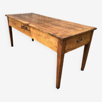 Antique solid cherry farm table with 3 drawers.
