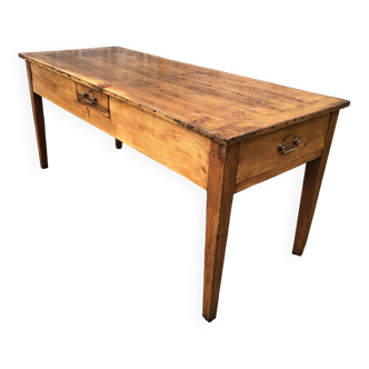 Antique solid cherry farm table with 3 drawers.