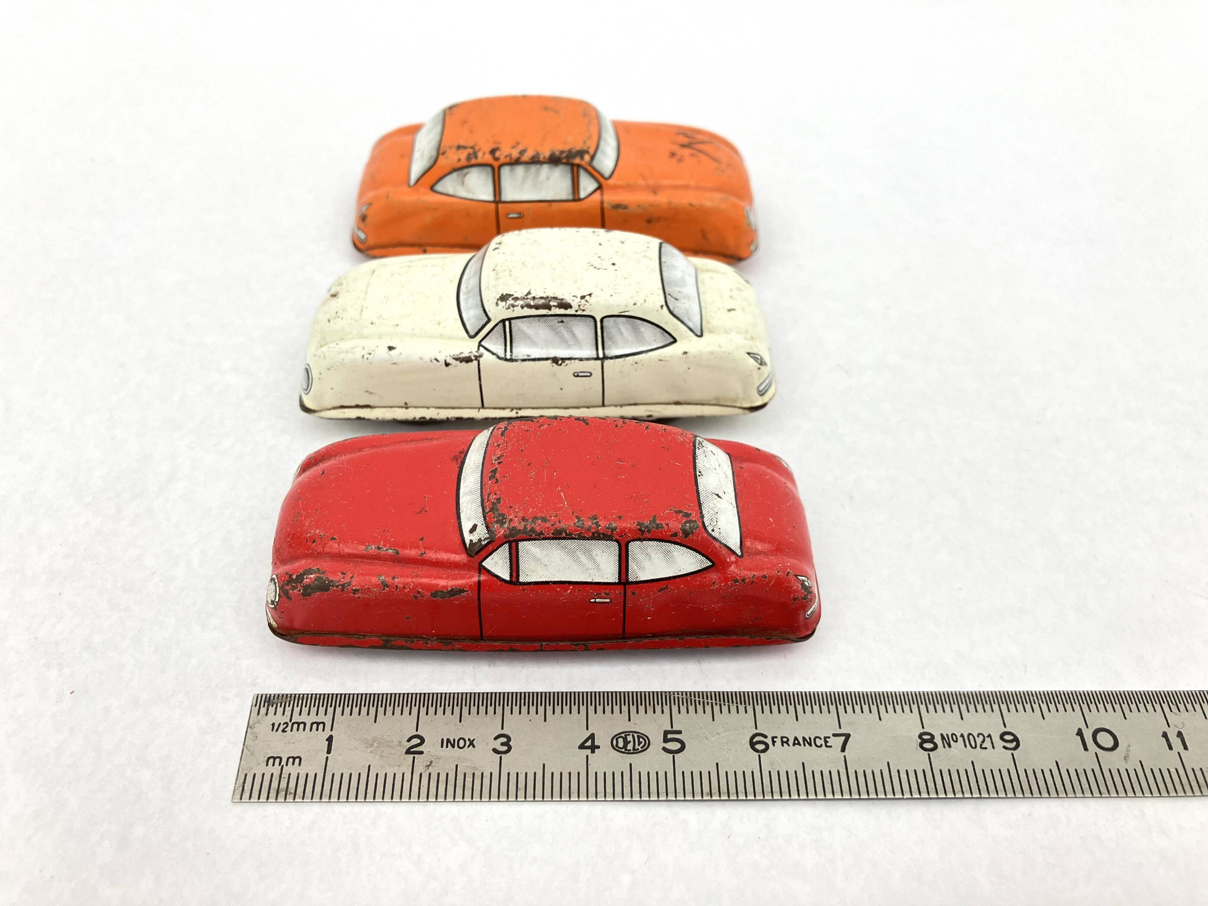 3 old small tin circuit cars with lead wheels • Vintage • 1960s