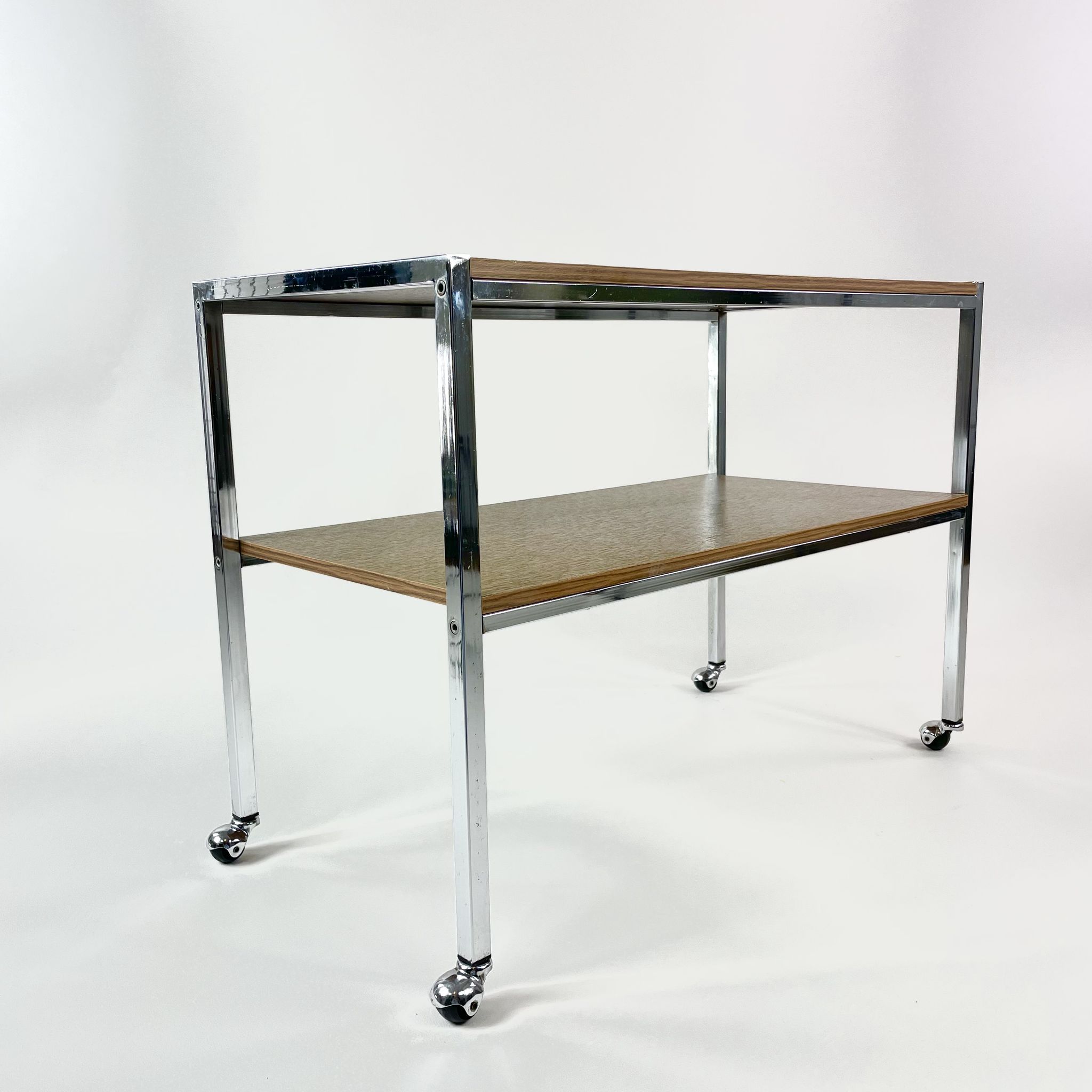 Table on wheels, laminate top and metal Eiffel legs, circa 1950