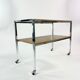 Table on wheels, laminate top and metal Eiffel legs, circa 1950