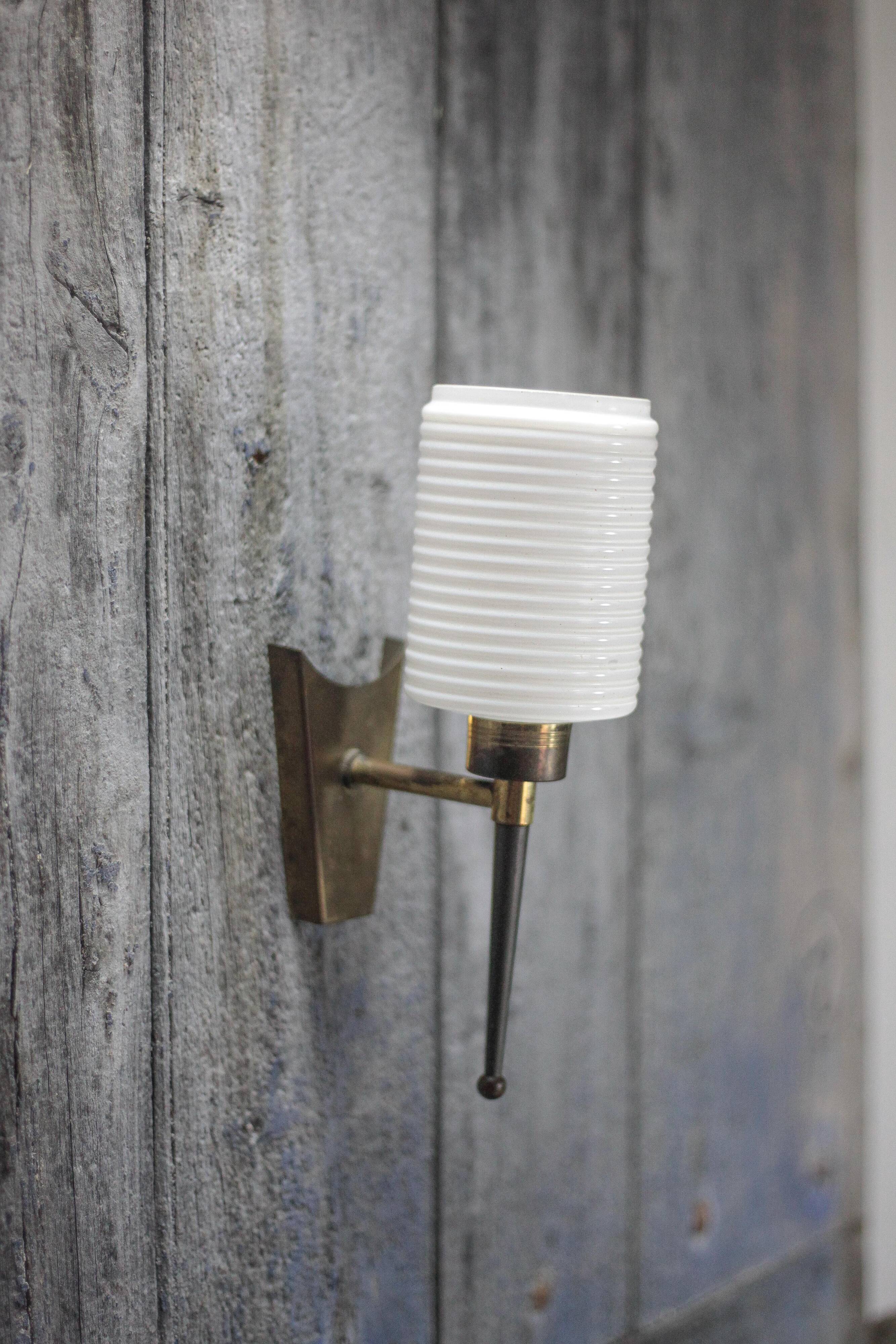 Brass wall light, black lacquered metal and white opal glass, 50s.
